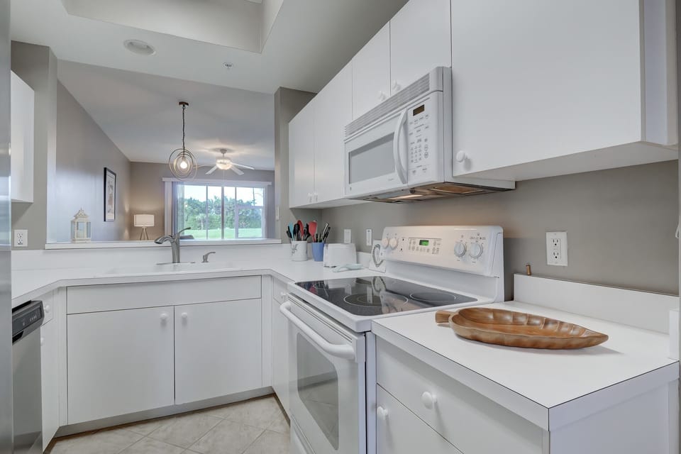 The Kitchen Has A Large Open Pass Thru to the Formal Dining Area