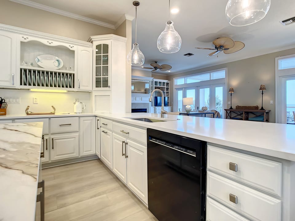 Kitchen open to family room and dining area with beach views