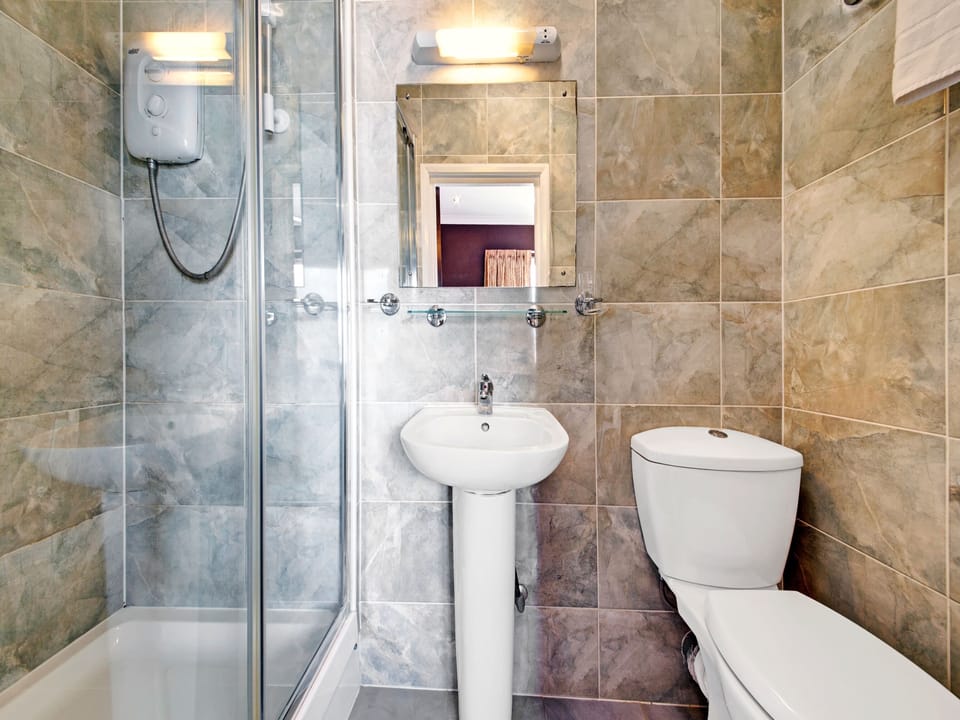 Family Room, Multiple Beds | Bathroom | Shower, free toiletries, hair dryer, towels