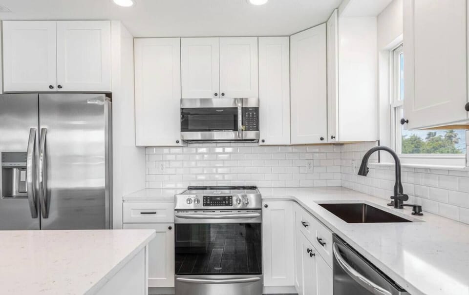 Kitchen with new state of the art stainless steel appliances 