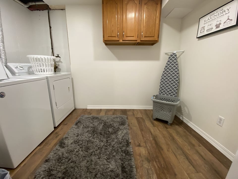 2 nd laundry room downstairs  / iron and ironing board 