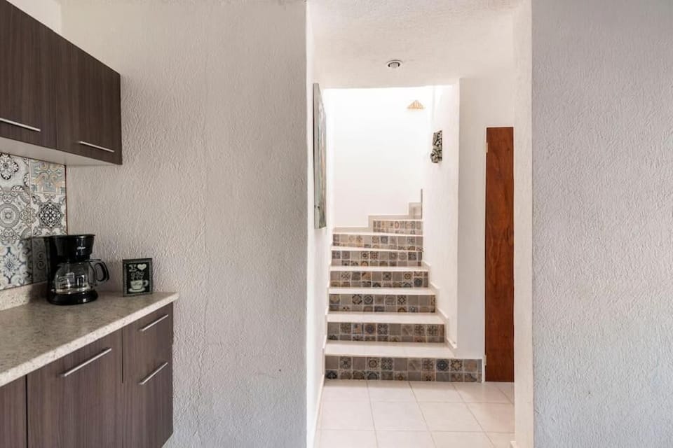 Stairs to the upper 2 levels of the house 