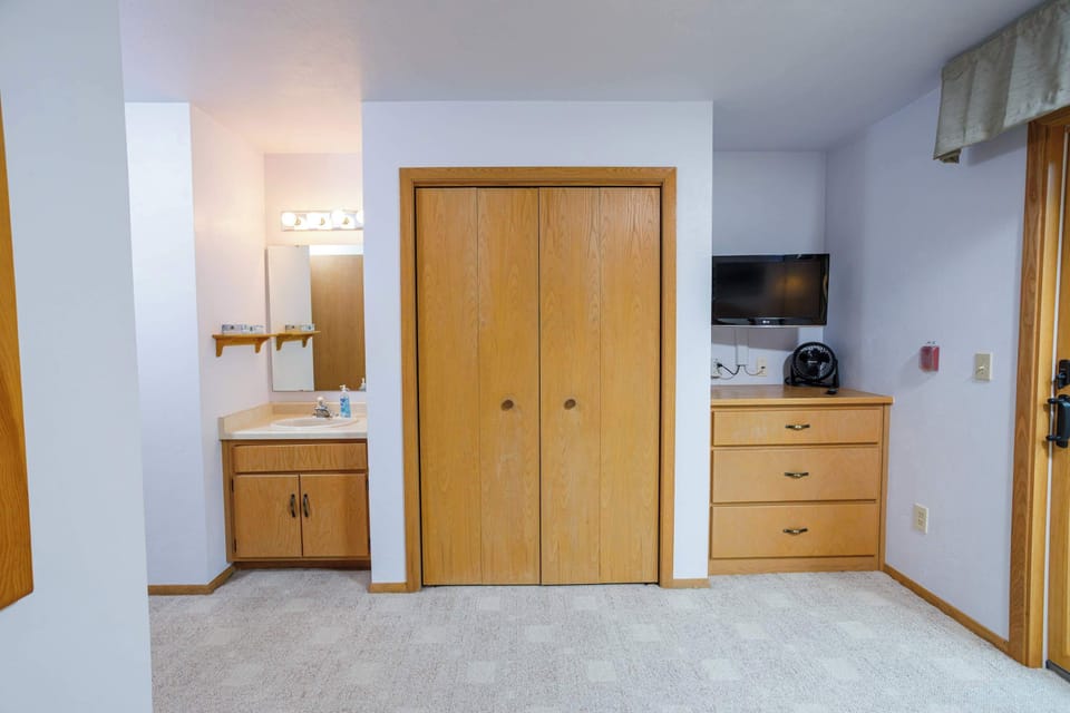 Primary bedroom (second floor) includes a sink, vanity, storage, and Smart TV