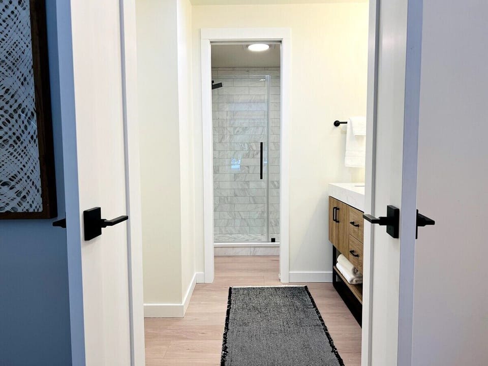 Downstairs bathroom, with double vanity and shower