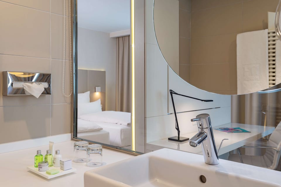 Deep soaking tub, rainfall showerhead, eco-friendly toiletries