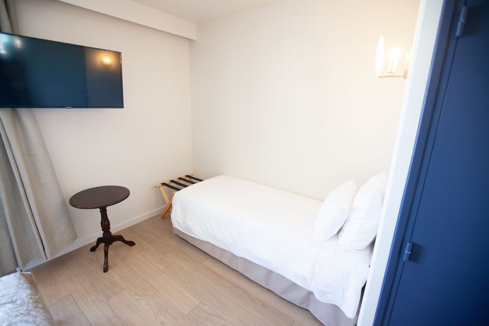 Triple Room | Pillowtop beds, individually furnished, blackout drapes