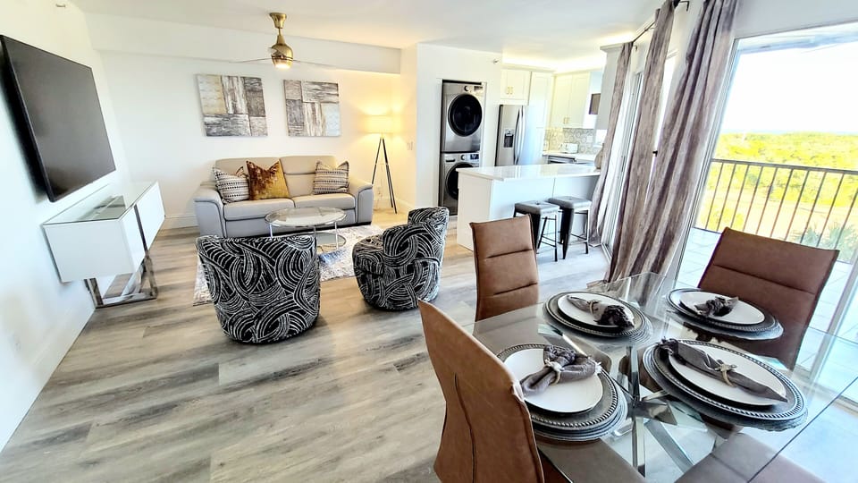 Spacious Open Plan Interior-Unit Features Stackable Full Size Washer & Dryer