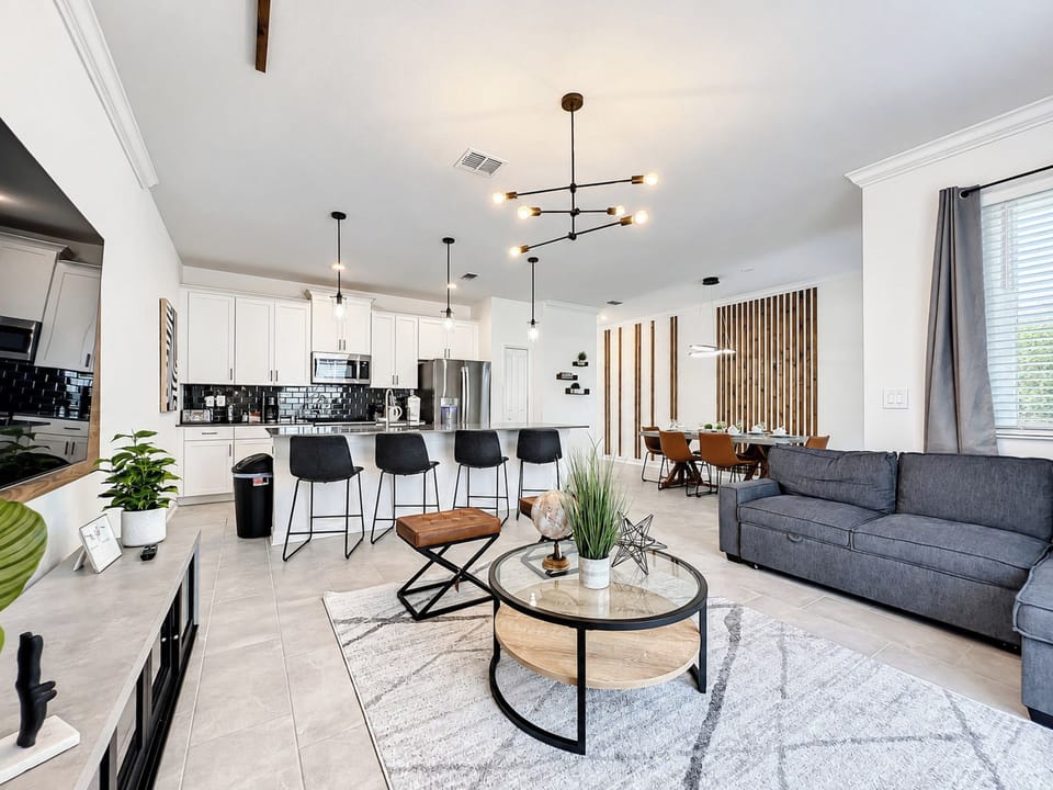 Open-Concept Living Area with Modern Kitchen and Dining