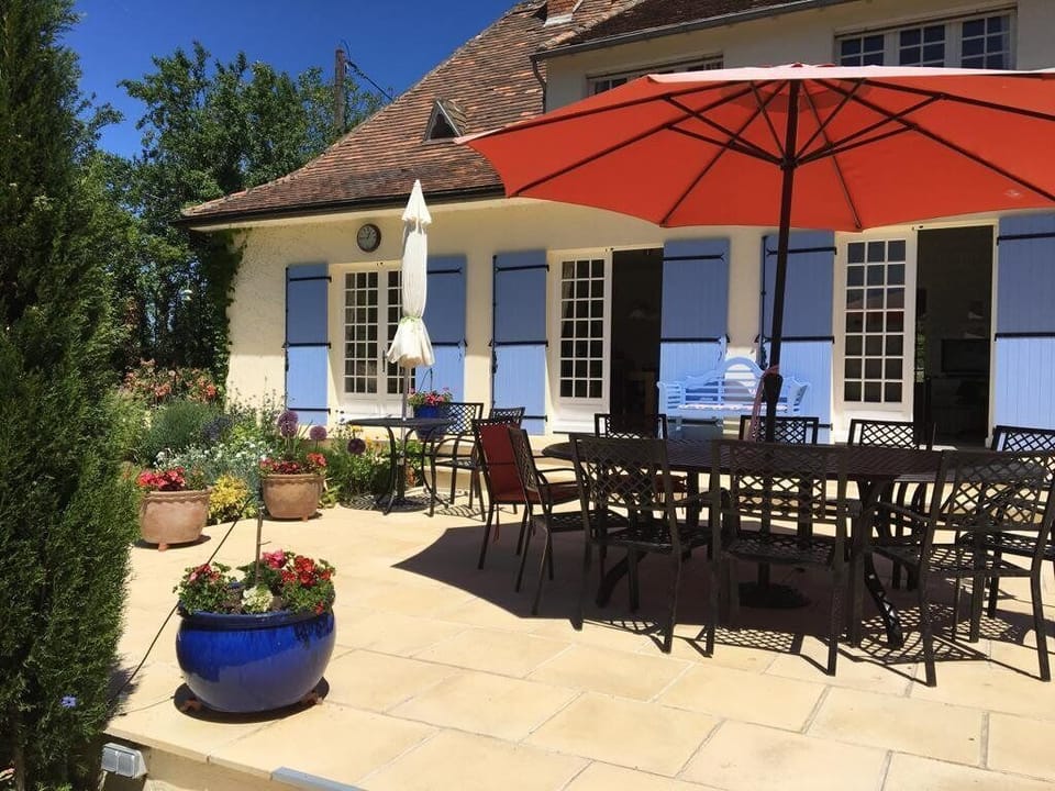 Large south-facing terrace, table seats12.  Plenty of large parasols for shade.