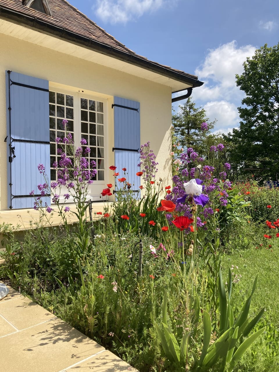 the well stocked gardens encourage the sights and sounds of summer. 