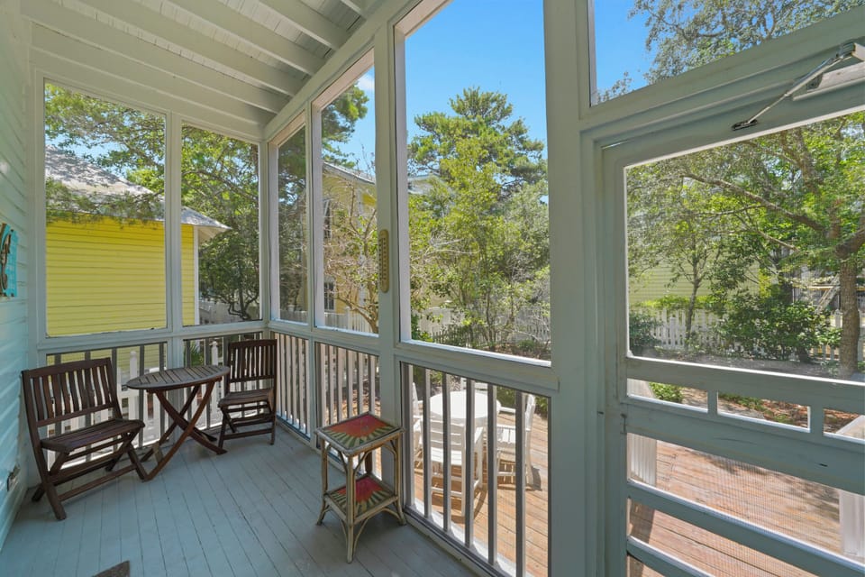 SCREENED REAR PORCH W/BISTRO SEATING OVER LOOKING FENCED YARD