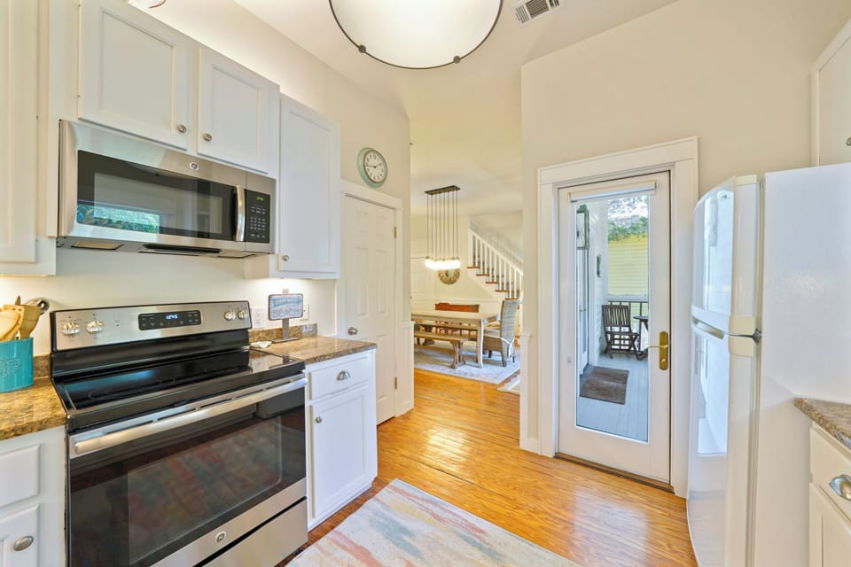 KITCHEN ALTERNATE VIEW TO DINING AND REAR PORCH ACCESS