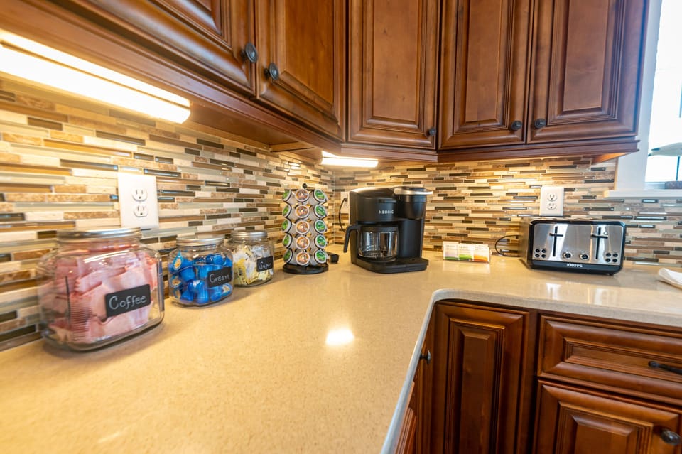 Fully equipped kitchen with a coffee and tea bar. 