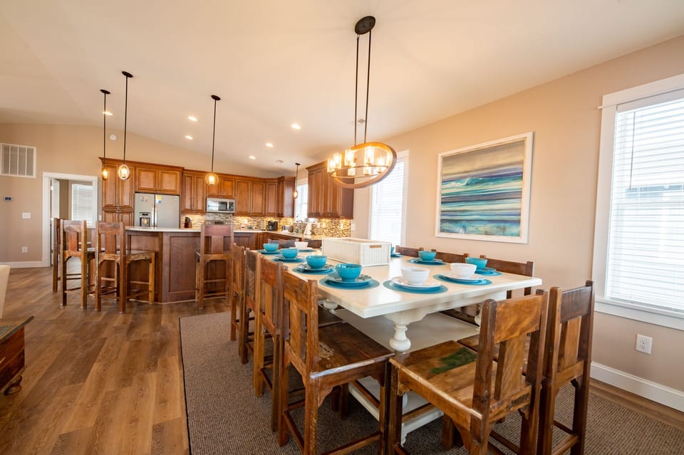 Our large dining table has seating for 12 with 4 additional seats at the island!