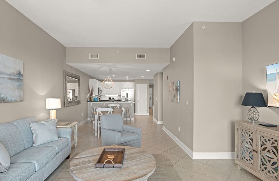 Open-concept layout seamlessly blending living, dining, and kitchen spaces—perfect for your beach getaway.