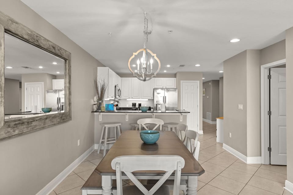 Your dining area flows effortlessly into a bright kitchen, perfect for gathering over meals and sharing vacation moments together.