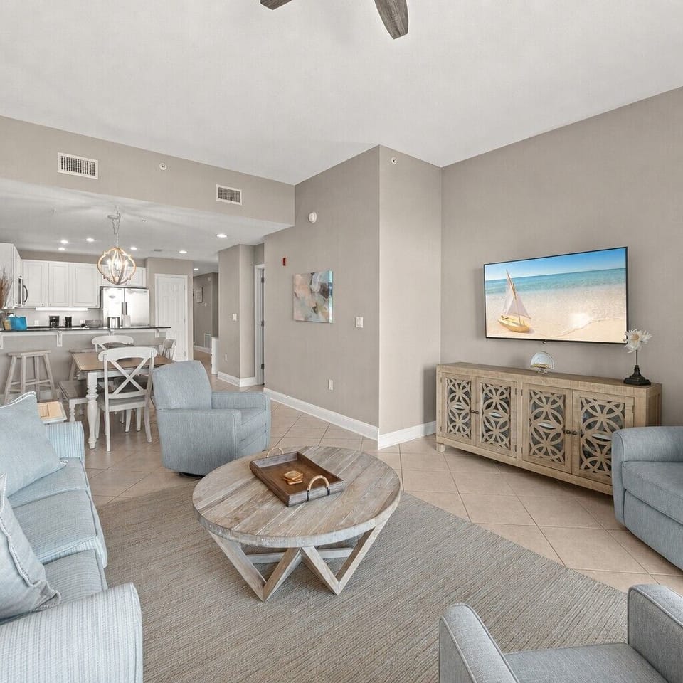 Settle into your bright, open living space with coastal colors and a relaxing vibe where you can unwind after beach days and enjoy your favorite shows.
