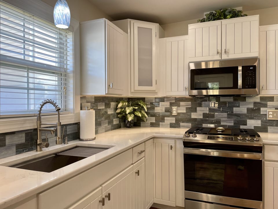Quality stainless steel appliances including gas stove.