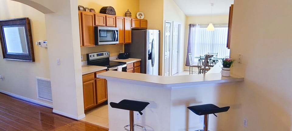 Kitchen with bar sitting area
