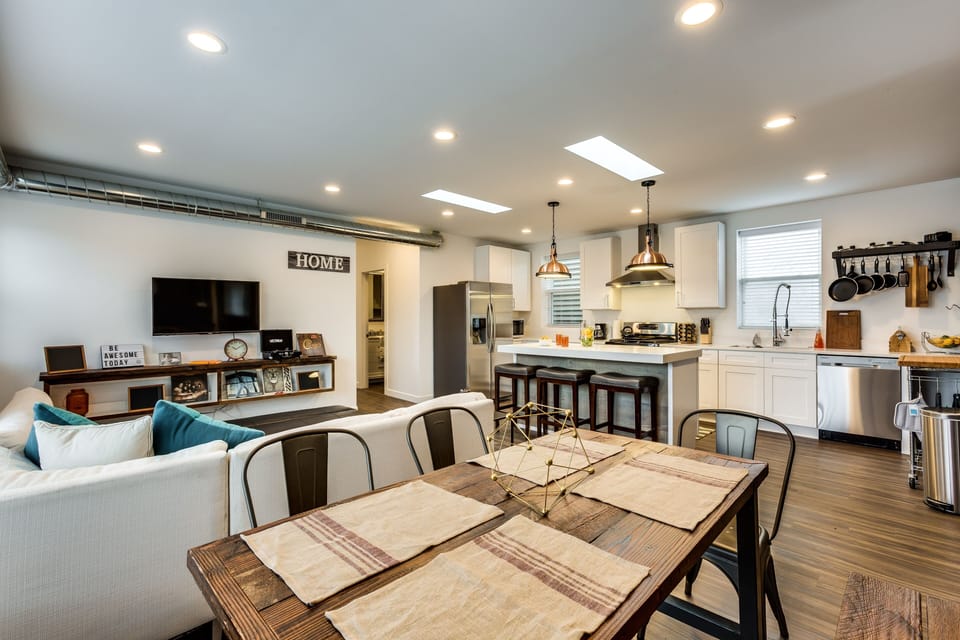 The dining room, living room, and kitchen are all open to each other