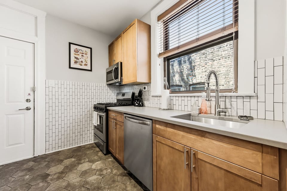 Quartz countertops provide ample prep space for cooking and entertaining.