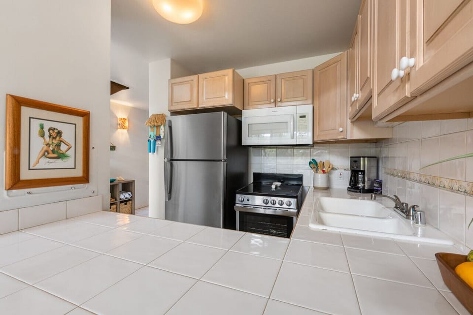 Sleek kitchen w/ stainless appliances & roomy counters for easy meal prep.