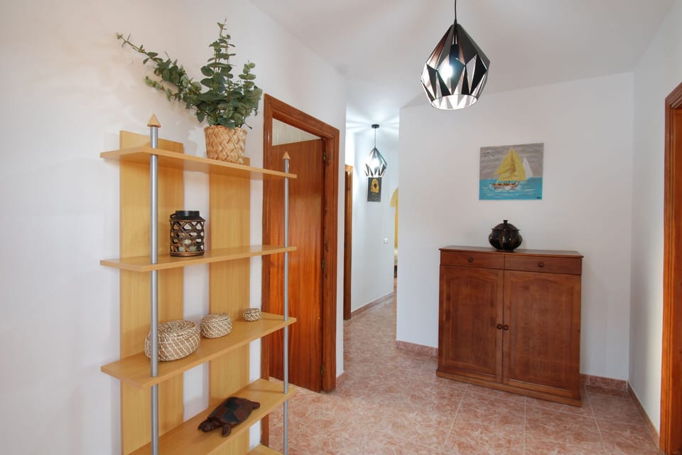 The hall with entrance to the kitchen and the  living room.