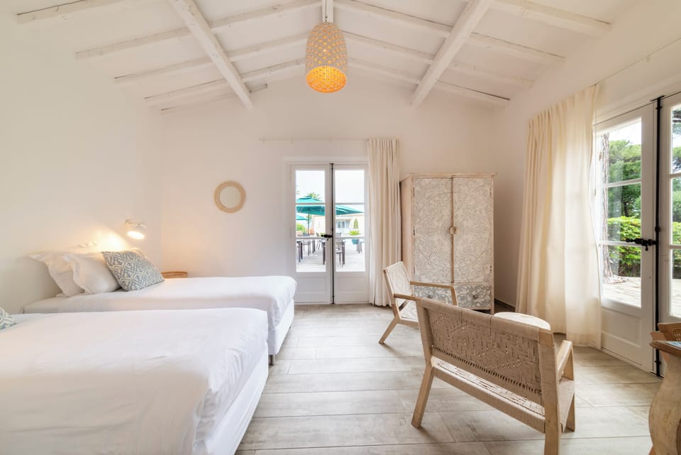 Family Room | Minibar, in-room safe, individually decorated, desk