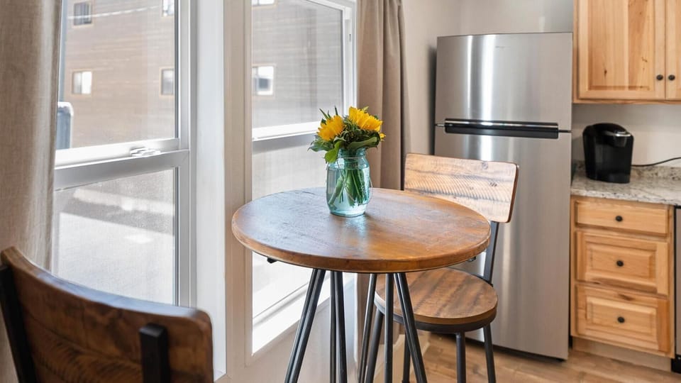 The large kitchen is fully stocked with cookware and top of the line appliances. The kitchen also features a cozy coffee nook with seating for two.