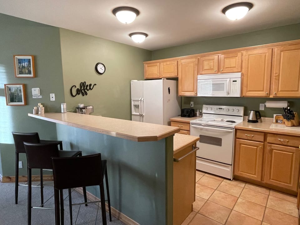 fully stocked kitchen w/ coffee maker, crock pot, blender, etc