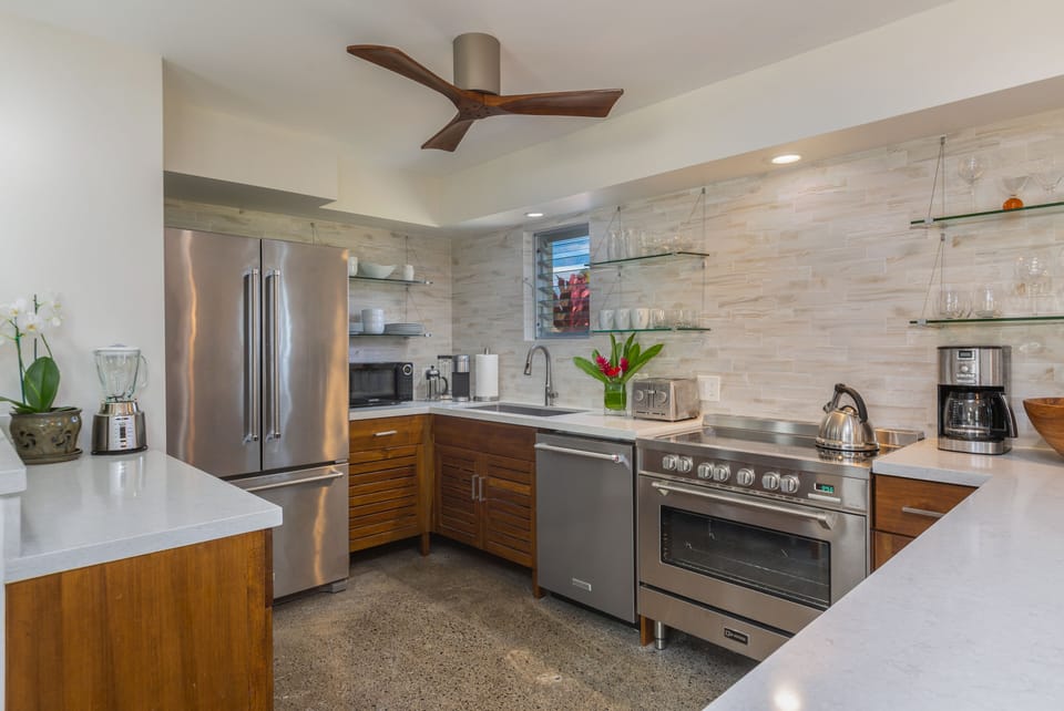 Kitchen featuring numerous countertop appliances.