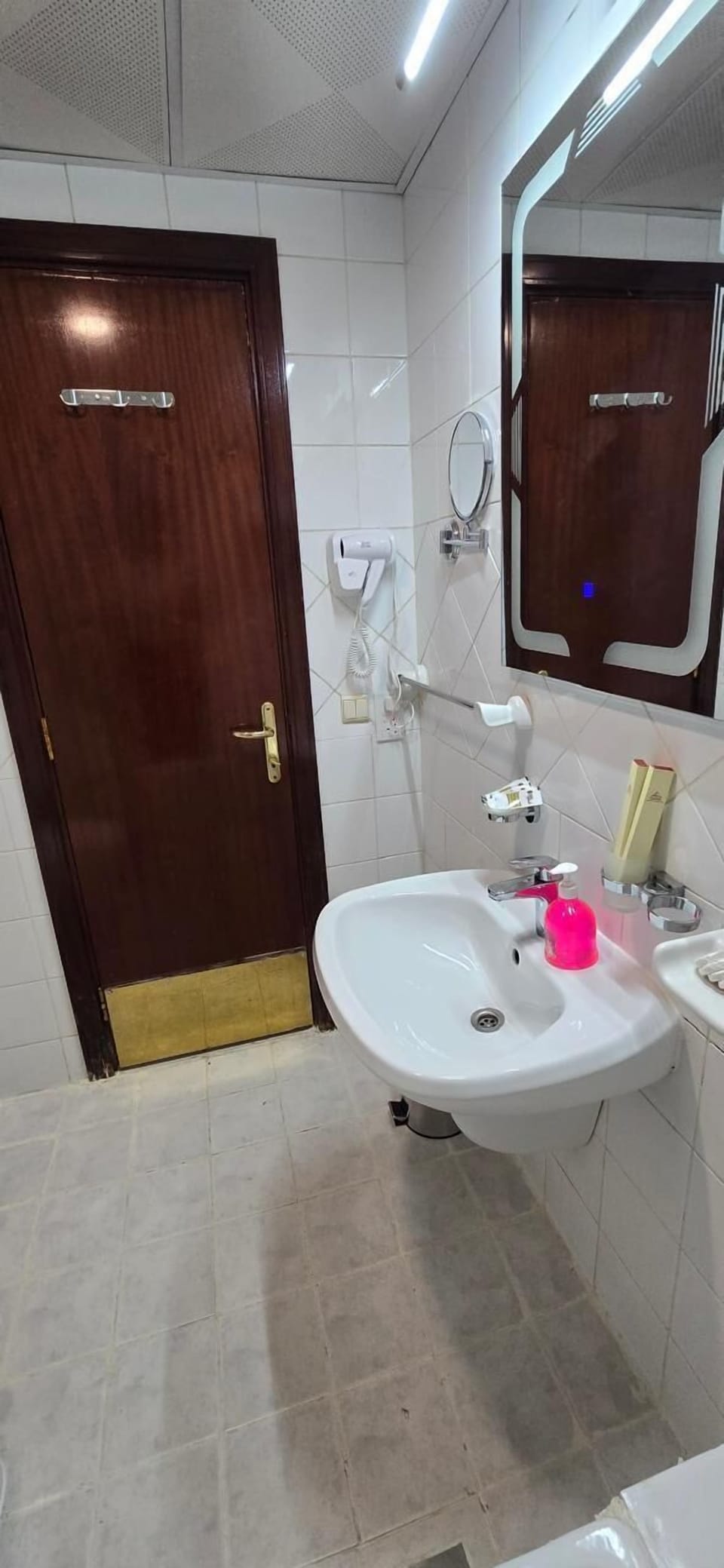 Shower, hair dryer, slippers, towels