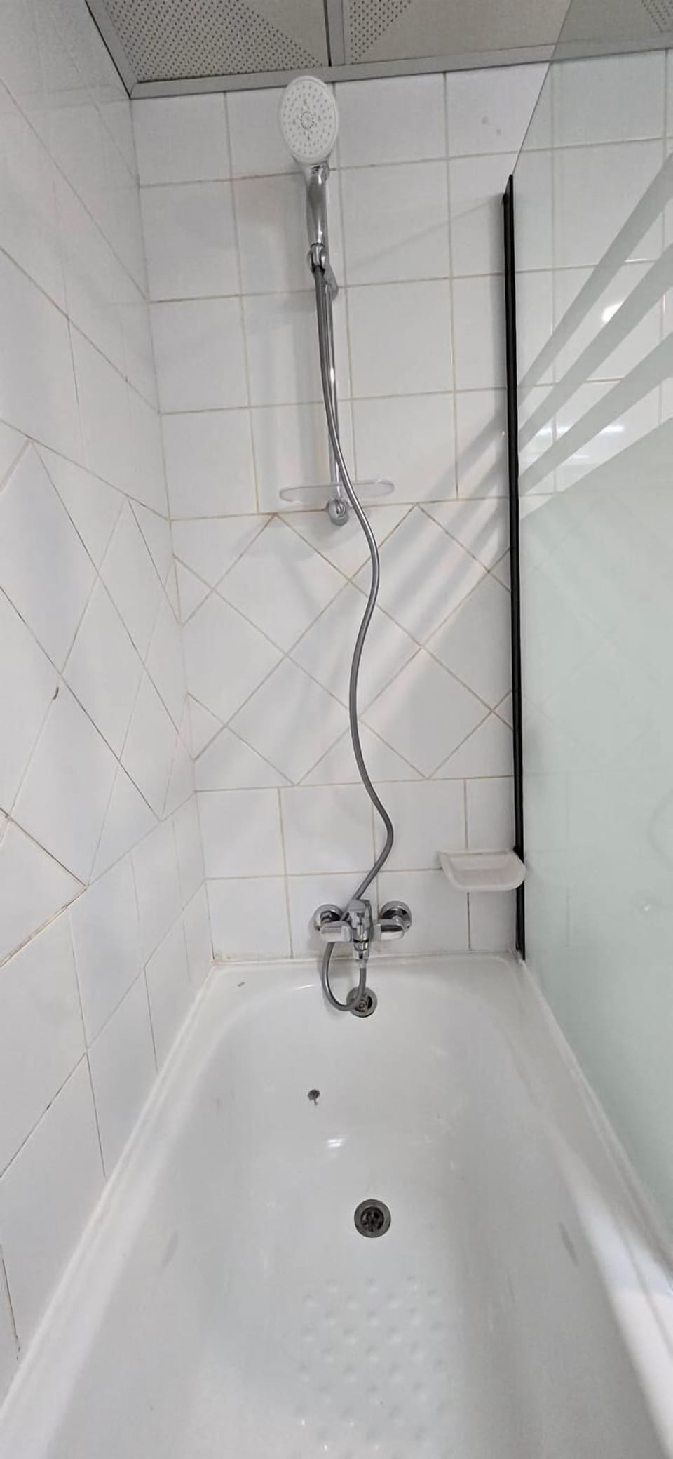 Shower, hair dryer, slippers, towels