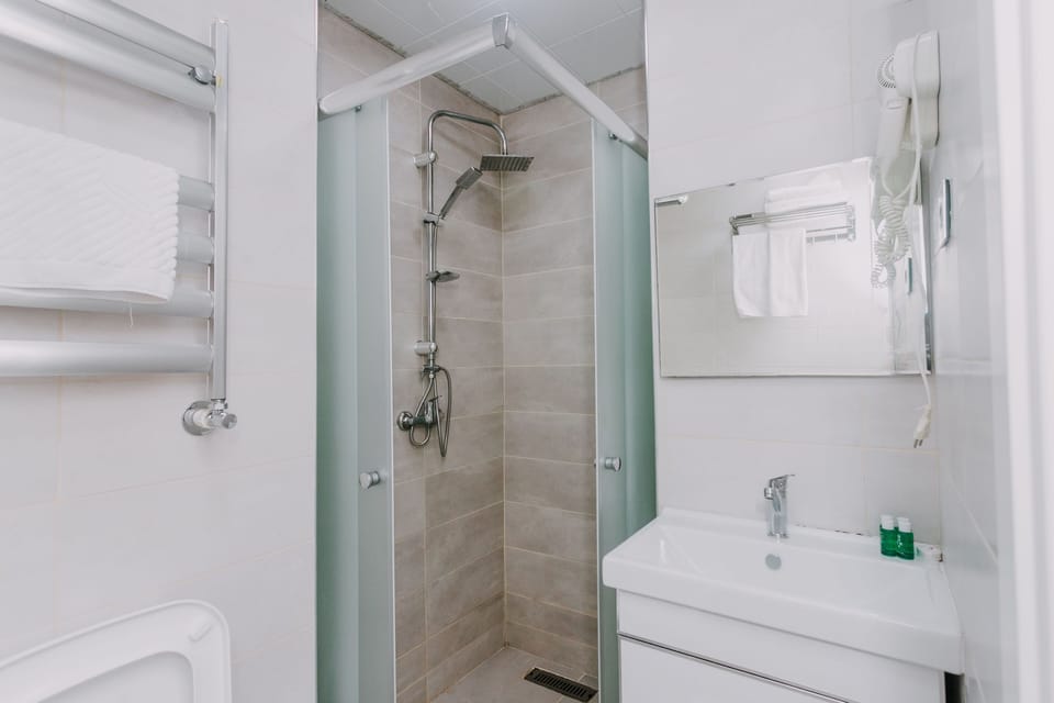 Shower, free toiletries, hair dryer, slippers