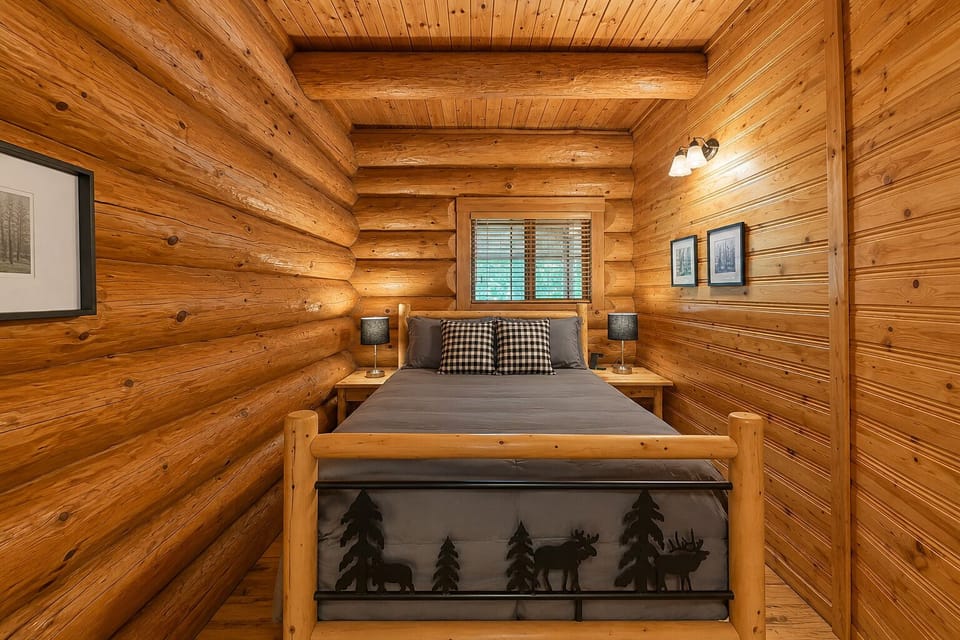 Main Floor Bedroom with Queen Bed and Dresser.