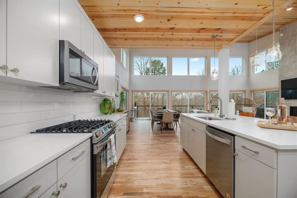 Kitchen: Sleek design with ample natural light and modern appliances for culinary adventures!
