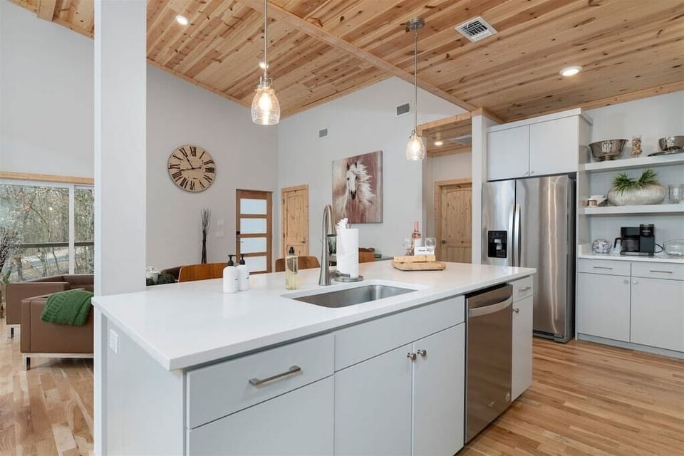 Kitchen: Sleek design meets rustic charm; cook up memories in this stylish, sunlit space!