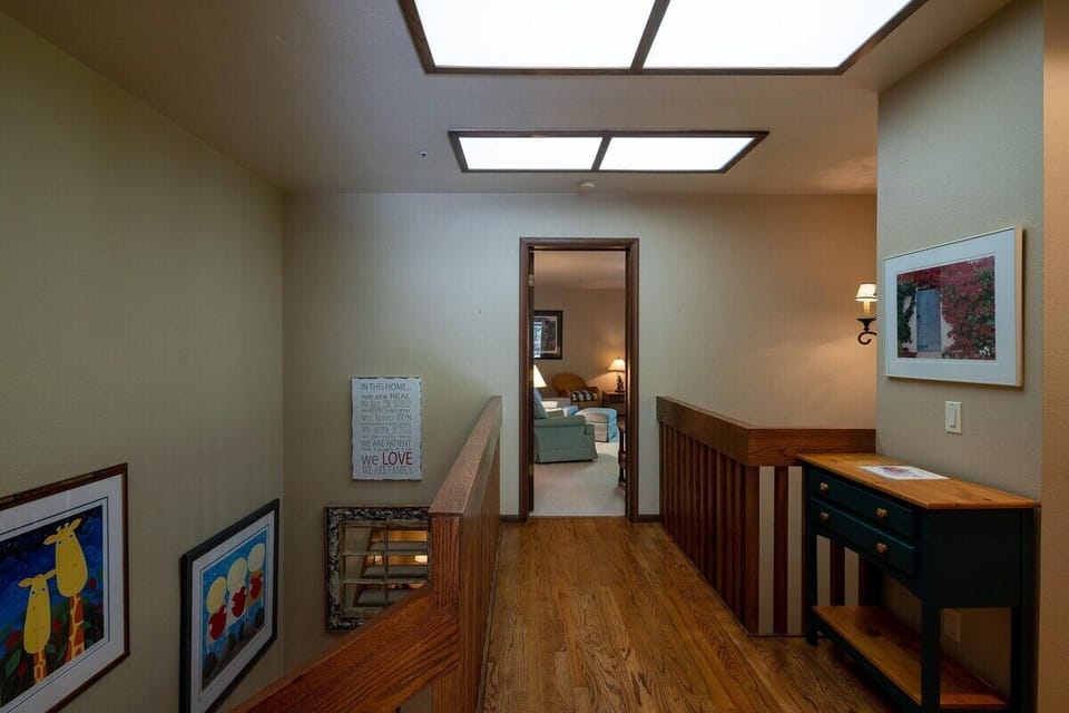 Upstairs landing leading from stairs to family room and bathroom