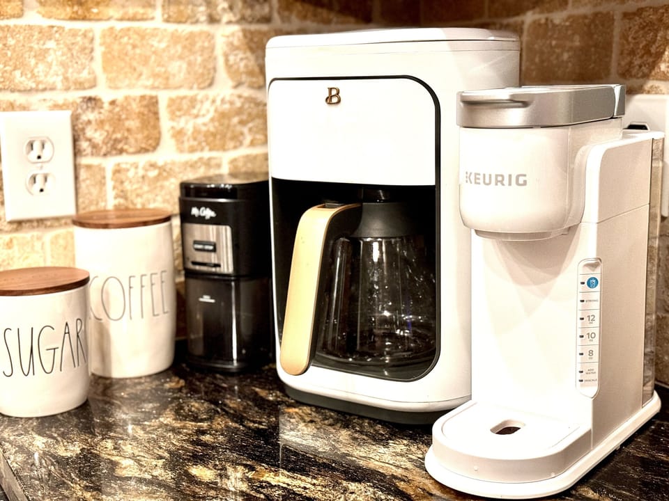 Start the morning right at our thoughtfully stocked coffee bar, featuring a grinder, drip coffee maker, Keurig, and French press to suit every preference. We provide sugar and organic K-Cups.