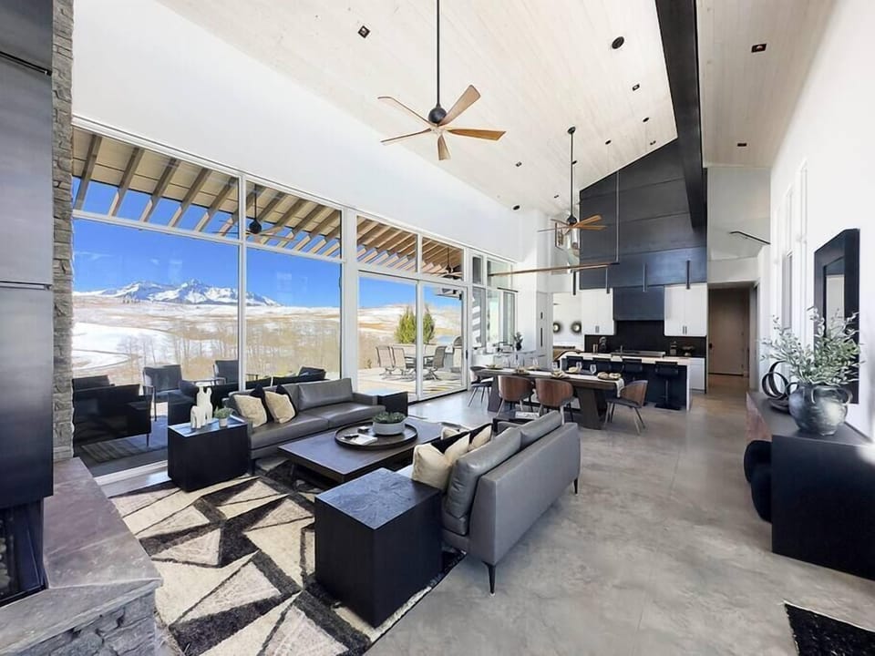 The great room boasts huge views of Wilson Peak and the golf course.