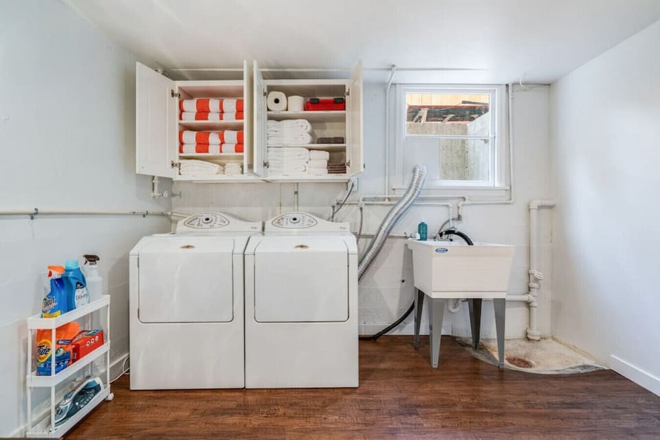 Laundry area fully stocked with all the amenities for a comfortable stay: extra sheets, hot tub towels, toilet paper, paper towels, first aid kit, bath towels, etc.!