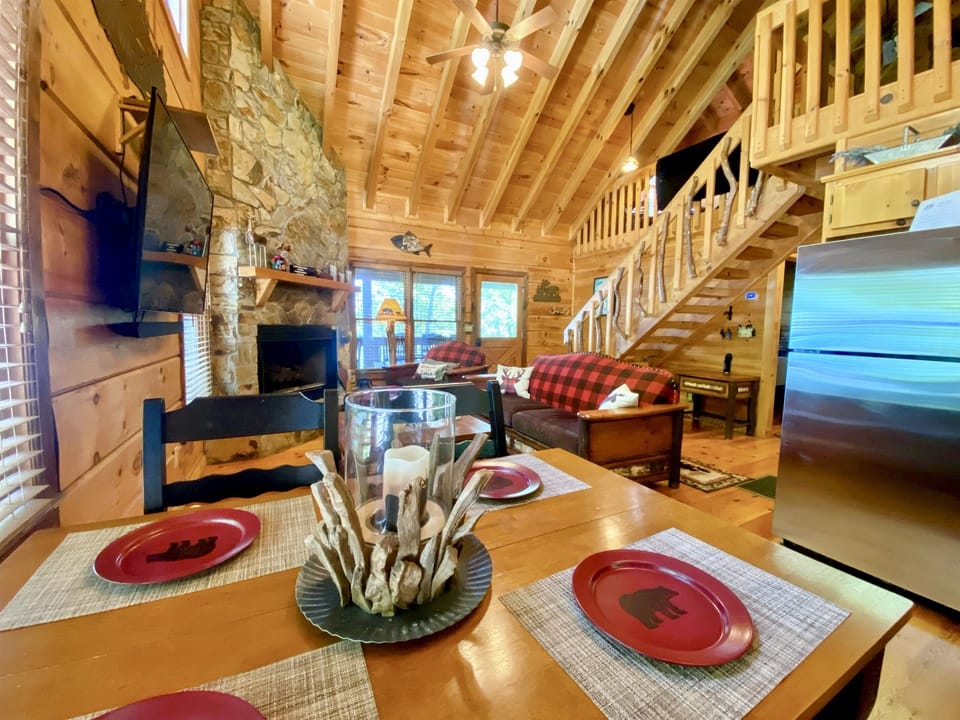 Living Room with cozy stone gas log fireplace