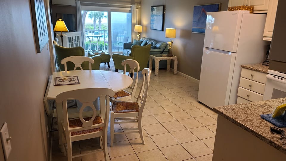 Condo has tile floors, dining for 6, lots of seating in living room!