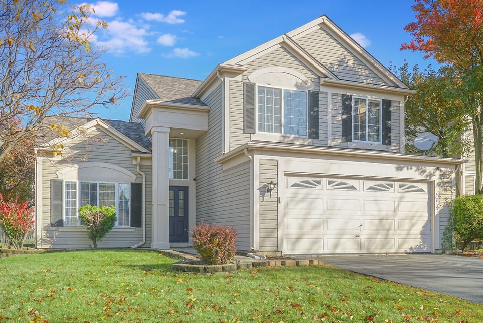 Exterior view of the house - enjoy cornhole and a picnic table in the backyard!