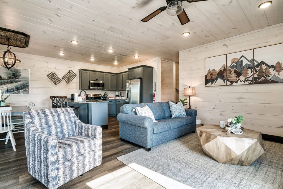 Living room with floor to ceiling windows that maximize sunlight. It's simply beautiful.