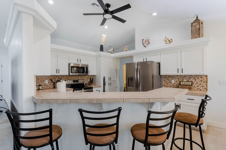 Kitchen with a bar area, perfect for casual dining and entertaining