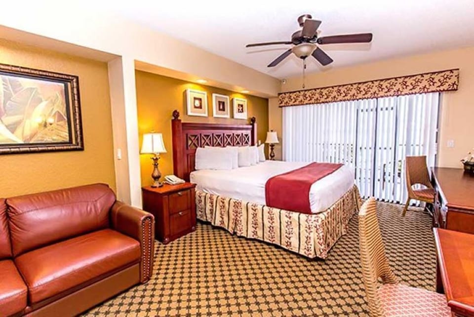 King sized bed with a sleeper sofa and desk 