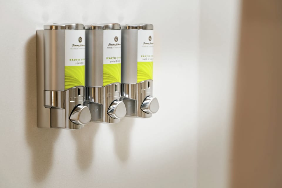 Designer toiletries, hair dryer, bathrobes, towels