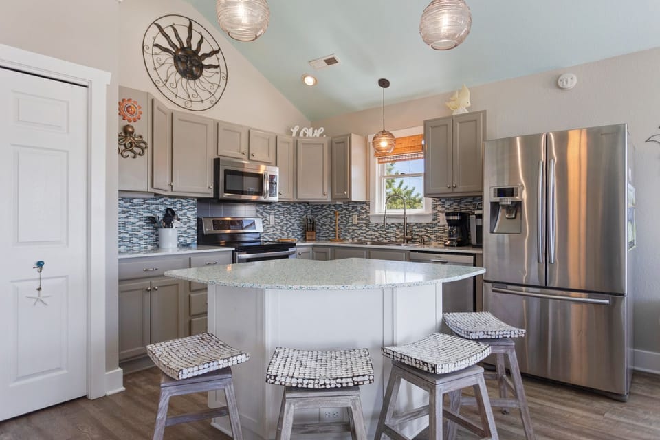 Whip up something delicious in the modern Kitchen with modern amenities and a countertop island.