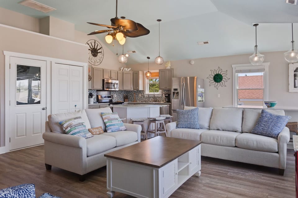 Unwind in the Living Area with plenty of cozy furniture and high ceilings.